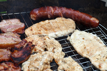 barbecue with delicious grilled meat on grill