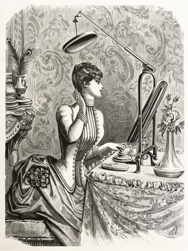 elegant woman looking at mirror. engraved illustration 1885