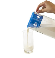 Glass and jar of milk