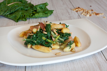 fresh salad with chard and pine nuts