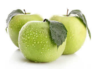 Ripe green apples with leaves  isolated on white