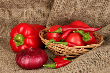 fresh red vegetables on sackcloth background