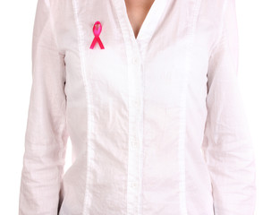 Woman with pink ribbon on white shirt isolated on white