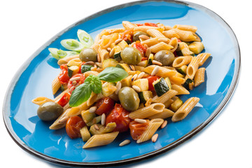 cold pasta salad with pachino olives zucchins and pine kernel