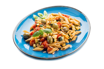 cold pasta salad with pachino olives zucchins and pine kernel