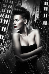 beautiful woman with red lips in rainy city