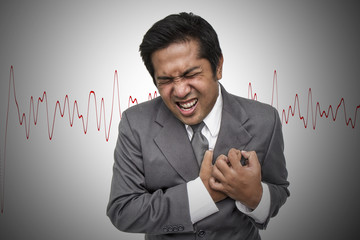 Businessman having heart attack