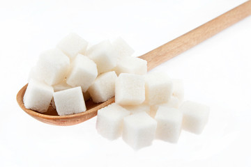 Lump sugar is in a wooden spoon
