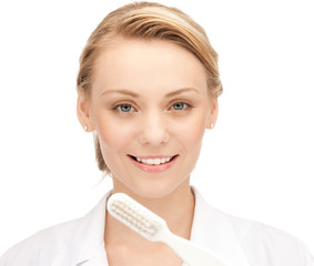 attractive female doctor with toothbrush