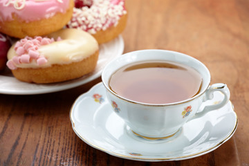 tea cup and doughnuts