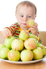 Fototapeta premium Baby eating apple