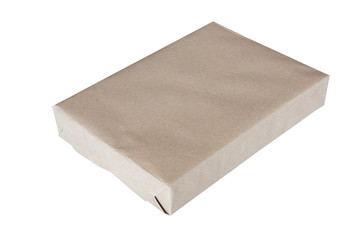 Parcel wrapped in brown paper and tied with rough twine and blan