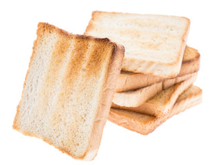 Heap of toasted bread on white