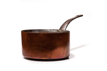 Copper saucepan isolated on a white studio background.