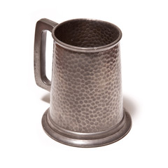 Pewter beer tankard isolated on a white studio background.