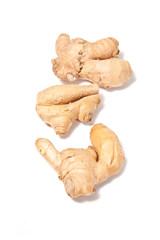 Root ginger isolated on a white studio background.