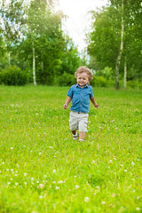 happy little kid running in park