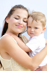 The little boy with mother on walk at the sea