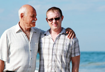 father and son on a beach