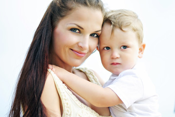 The little boy with mother on walk at the sea
