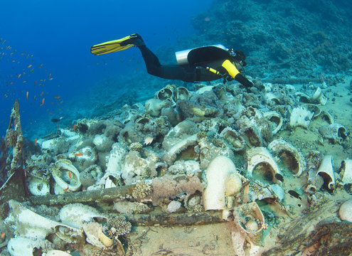 Scuba diver exploring wreckage