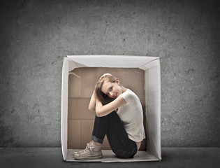 Blonde Girl Smiling Crouched in a Box