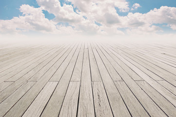 Cloudy blue sky and wood floor, background image. 
