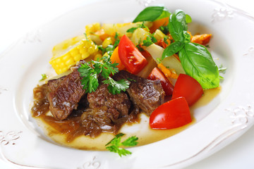 Traditional goulash or beef stew with vegetables and salad of fr