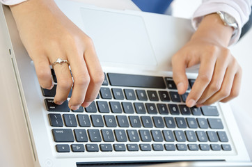 Fototapeta na wymiar typing on laptop keyboard