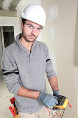 Builder using a voltmeter