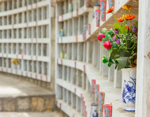 Collection of fake plastic flowers at a cemetary