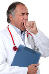 Tired doctor yawning