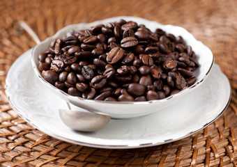Coffee beans in a white cup