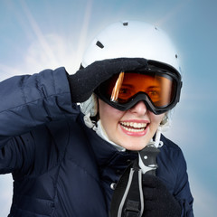 Young skiing woman looking for fun in winter sports