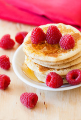 Stack of pancakes with raspberries