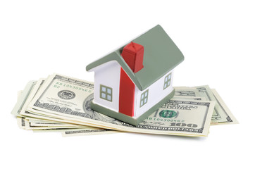 toy house for dollar banknotes as a background