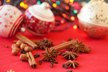 Closeup of spices and Christmas decorations in the background
