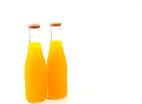 Two Orange Juice Bottles