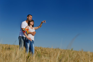 happy couple in wheat field