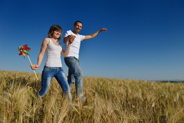 happy couple in wheat field