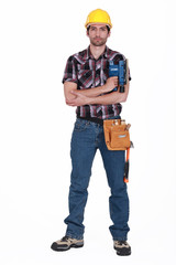 Portrait of a tradesman holding a sander