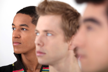 Portrait of three male students.