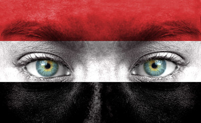 Human face painted with flag of Yemen