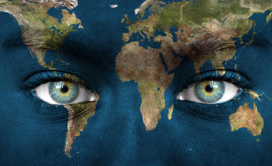Human face painted with planet earth