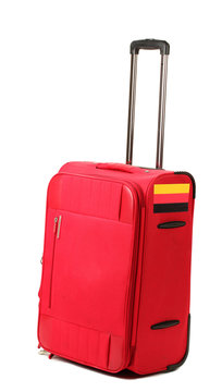 red suitcase with sticker with flag of Germany isolated on