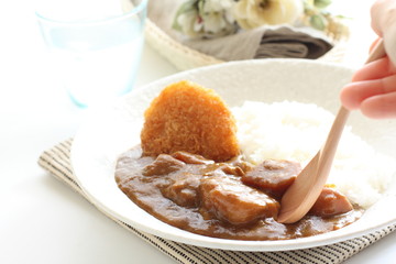Japanese beef curry served with rice and croquette