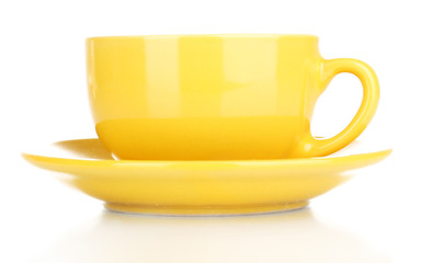 Yellow cup and saucer isolated on white