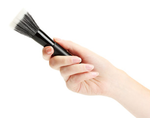 hand with black brush for make-up  isolated on white.