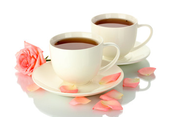 cups of tea with rose isolated on white