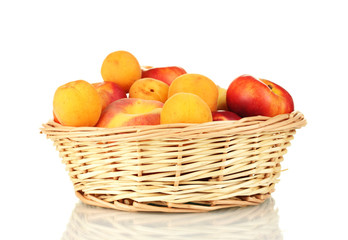 Ripe fruit in basket isolated on white